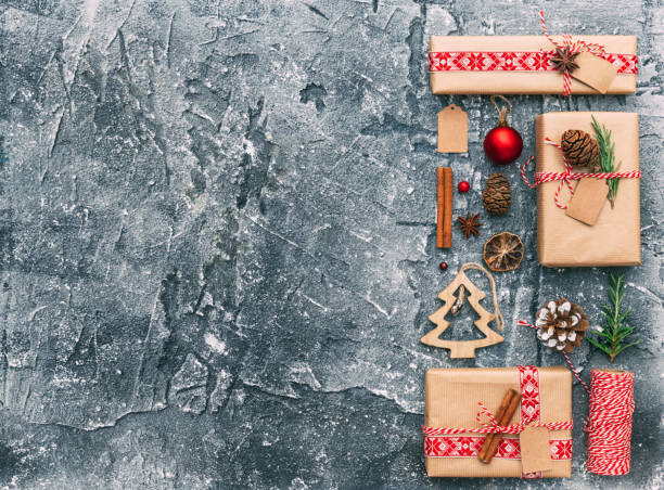 istock Christmas presents with decorations. Flat lay composition over dark background 885923126