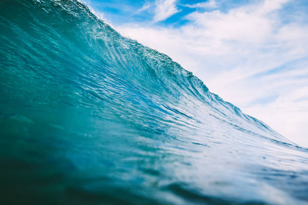 istock Blue barrel wave in ocean. Big wave for surfing 885928864
