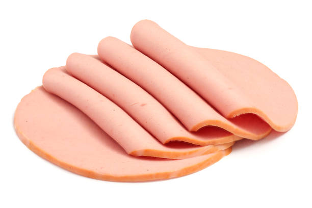 sliced boiled ham sausage isolated on white background - bologna imagens e fotografias de stock