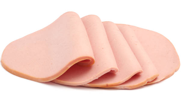 istock Sliced boiled ham sausage isolated on white background 885946956