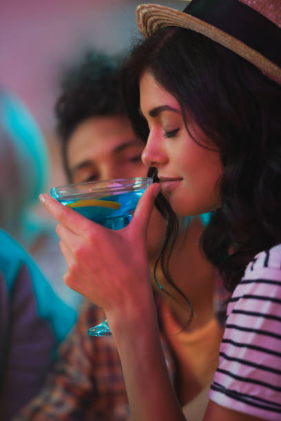 istock woman smelling cocktail 885951196