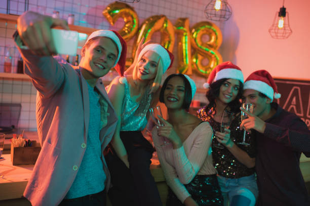istock multiethnic friends taking selfie 885959188