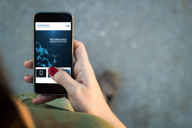 istock Woman walking smartphone innovative website 885965286