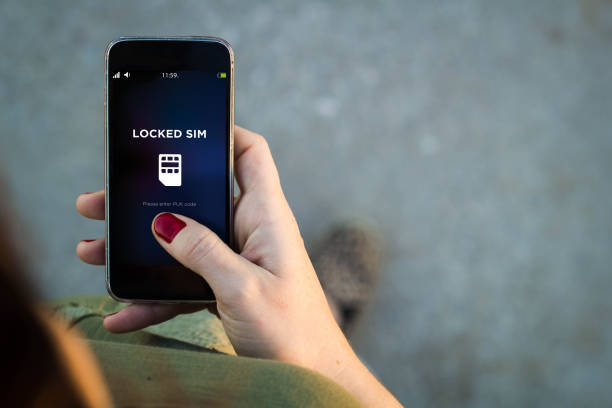 istock Woman walking smartphone locked sim 885965340