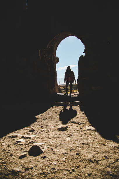 istock Woman on the ancient gate 885973628