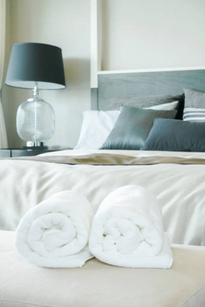 istock White towels with bedroom interior background 885977352