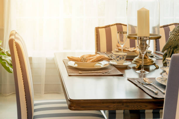istock Beautiful morning light with luxury table set in classic style dining room 885980904