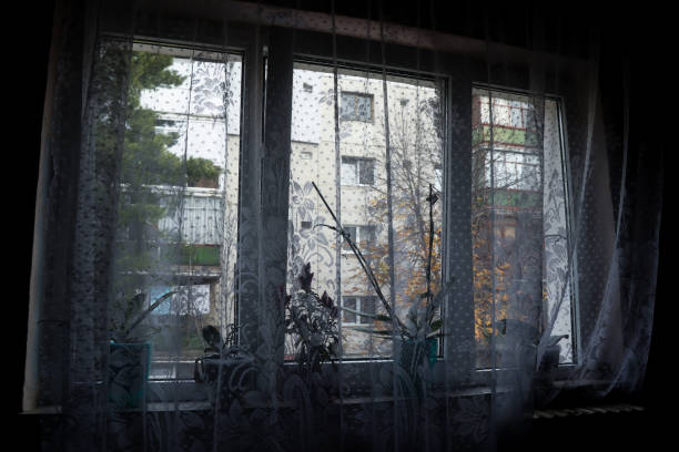 istock Window in the dark and curtains 885983370