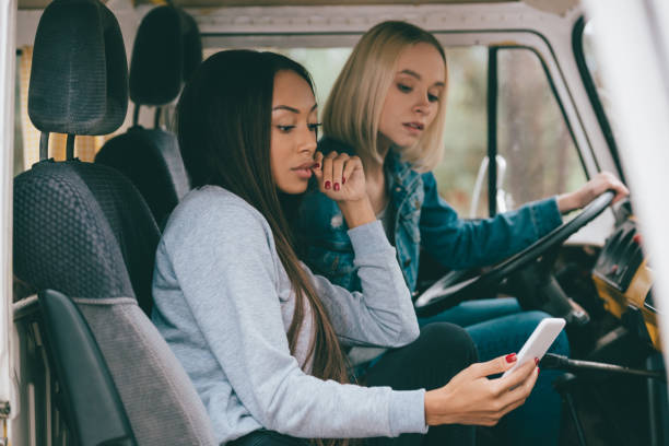 istock multiethnic girls driving minivan 885983508