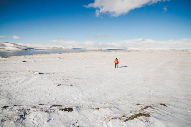 istock Woman walking on snow 885984050