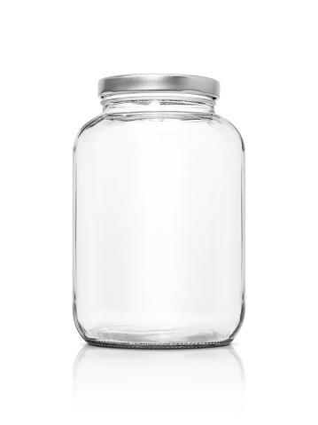 Clear glass bottle with silver cap isolated on white background with clipping path