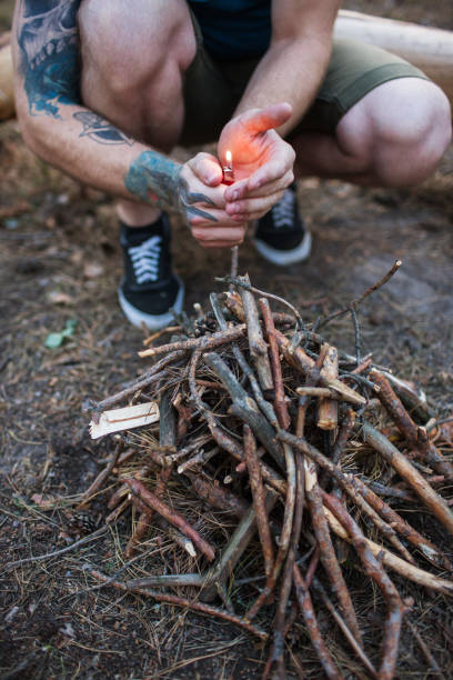 istock Bonfire preparation tourism nature forest concept. 885995600