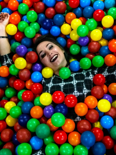istock Girl having fun in a ball pool 885997754