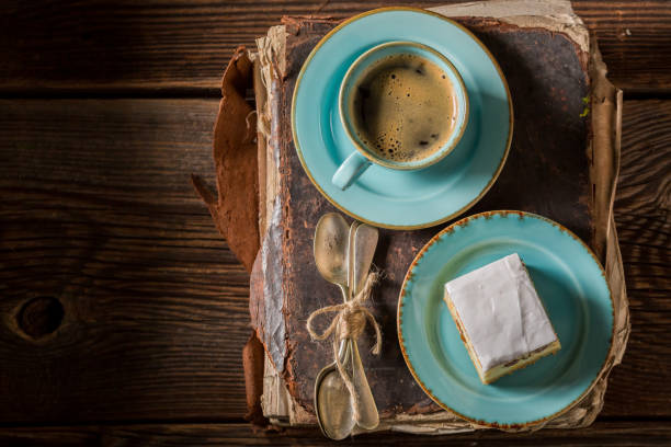 Delicious cheesecake and coffee served in blue porcelain