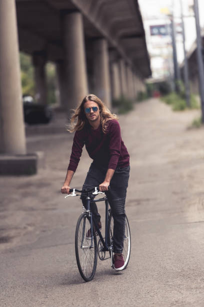 istock man riding vintage bicycle 886013010