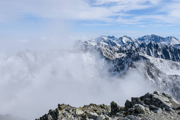 istock mountain tops in  autumn covered in mist or clouds 886013080
