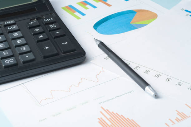 istock Home savings, budget concept. Calculator, pen,accounting books and chart on office table 886013136