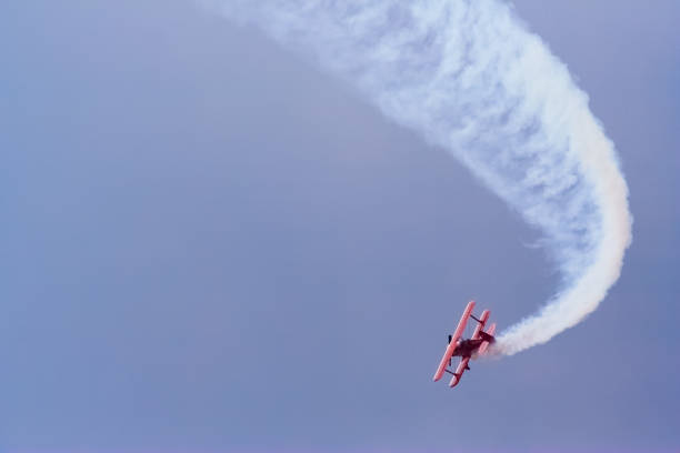 istock Red airplane in the blue sky 886013226