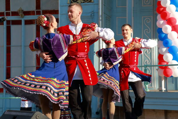 Cossacks dance on the stage a folk dance. Pyatigorsk, Russia Pyatigorsk, Russia - November 4, 2017: The Cossacks in traditional clothes dance on the stage a folk dance. Free festival in honor of National Unity Day. Stage near the Lermontov Gallery in Tsvetnik Park in Pyatigorsk, Stavropol Region, Russia north caucasus photos stock pictures, royalty-free photos & images