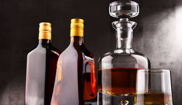 istock Carafe and bottles of assorted alcoholic beverages. 886022320