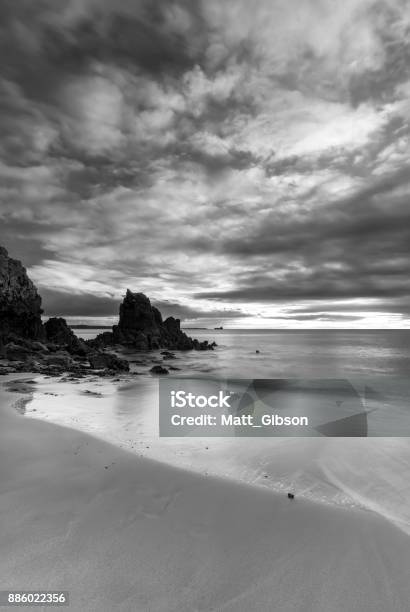 Stunning Black And White Sunrise Landscape Image Of Barafundle Bay On Pembrokeshire Coast In Wales Stock Photo - Download Image Now