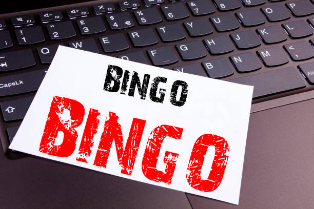 istock Writing Bingo text made in the office close-up on laptop computer keyboard. Business concept for Lettering Gambling to Win Price Success Workshop on the black background with copy space 886022852