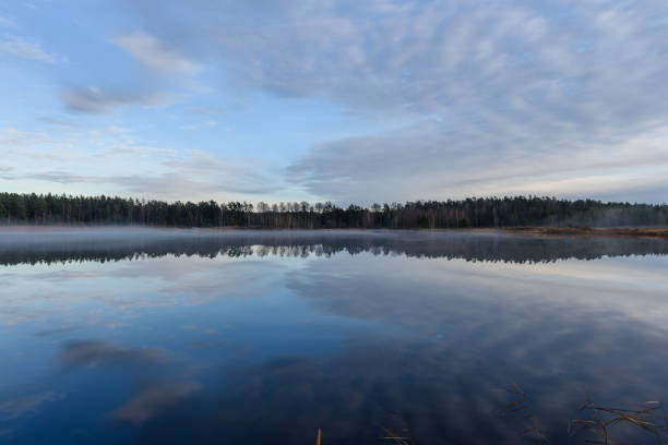 istock lake with water reflections in colorful autumn day 886023050