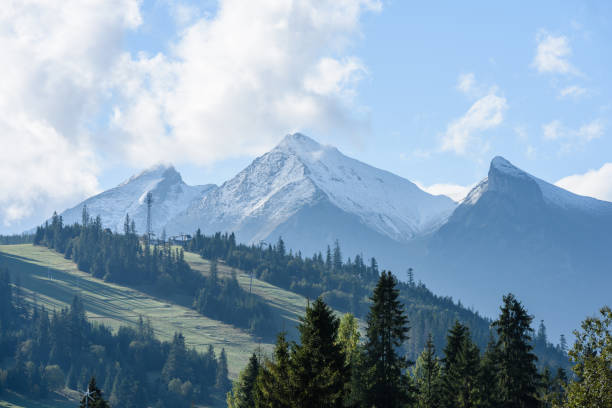 istock mountain tops in  autumn covered in mist or clouds in sunny day 886023106