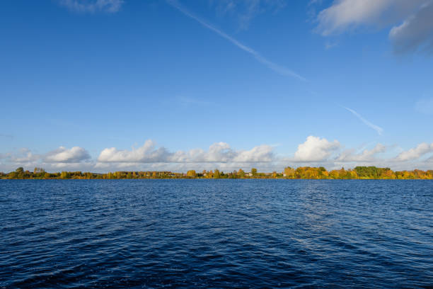 istock lake with water reflections in colorful autumn day 886023268