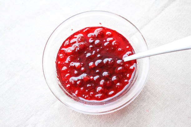 istock Berry jam in a vase. Top view 886025800