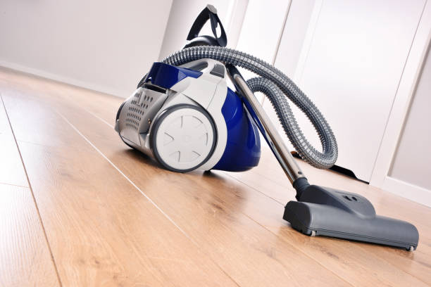 istock Canister vacuum cleaner for home use on the floor panels 886031452