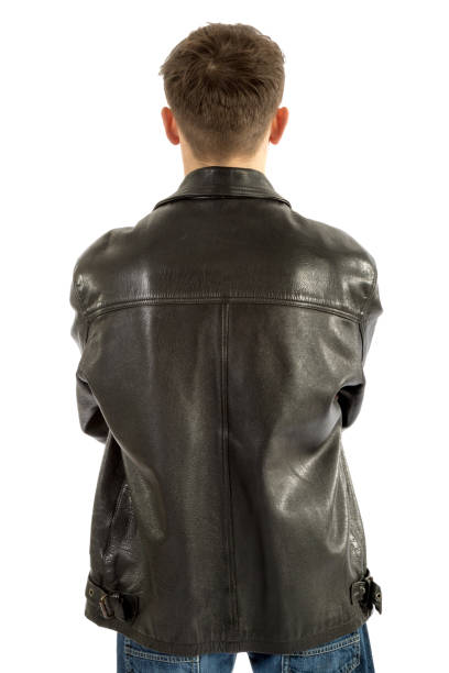istock 18 year old wearing a leather jacket and jeans 886032008