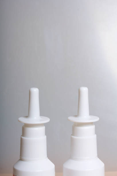 istock Nasal spray stand on the surface. On a white background. 886035536