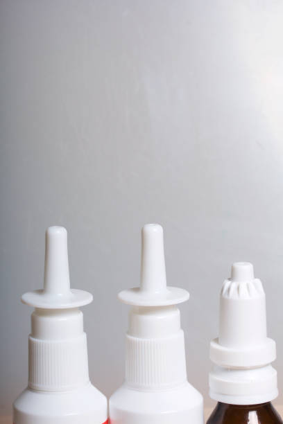 istock Nasal drops and spray stand on the surface. On a white background. 886035540