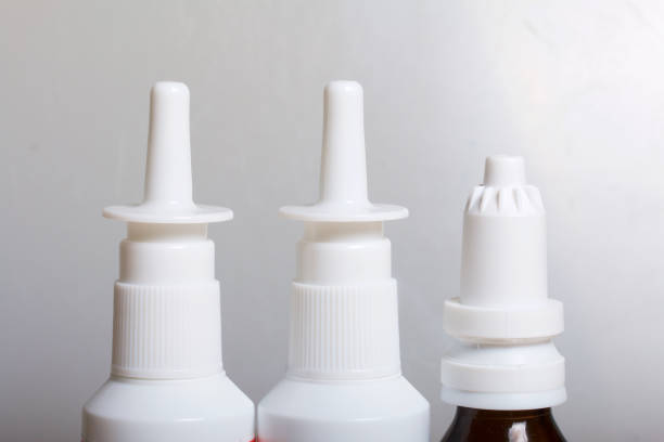 istock Nasal drops and spray stand on the surface. On a white background. 886035554