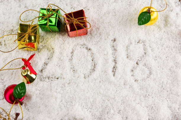 istock gift on snow with 2018 text,new year concept 886035970