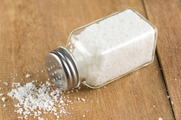 istock glass salt shaker  on wooden 886038504