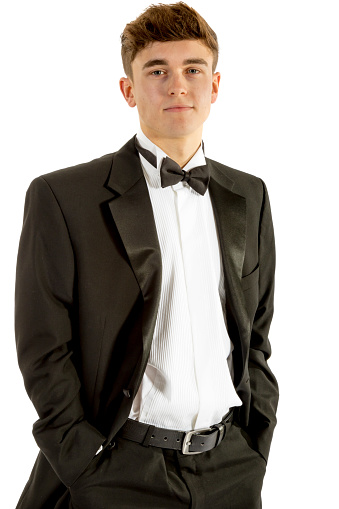 18 year old wearing a tuxedo isolated on a white background