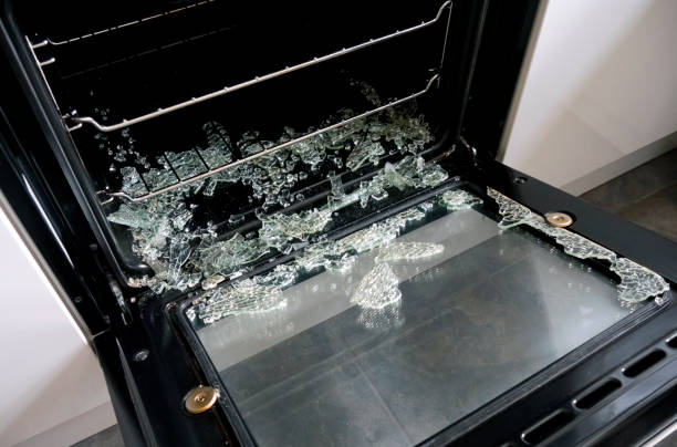 Exploded inner glass in oven door Shattered glass in an oven door, which had exploded whilst cooking a meal. oven door stock pictures, royalty-free photos & images