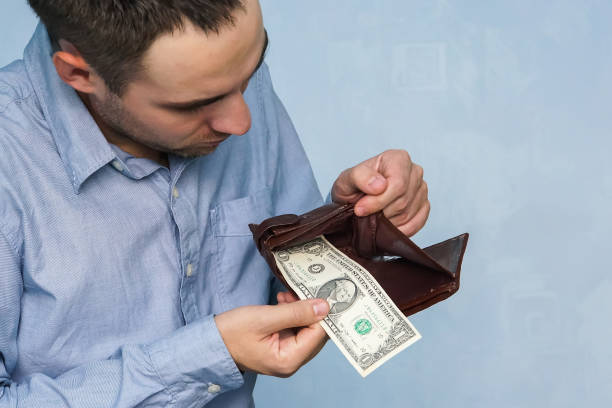 istock Man gets money from the wallet 886056224