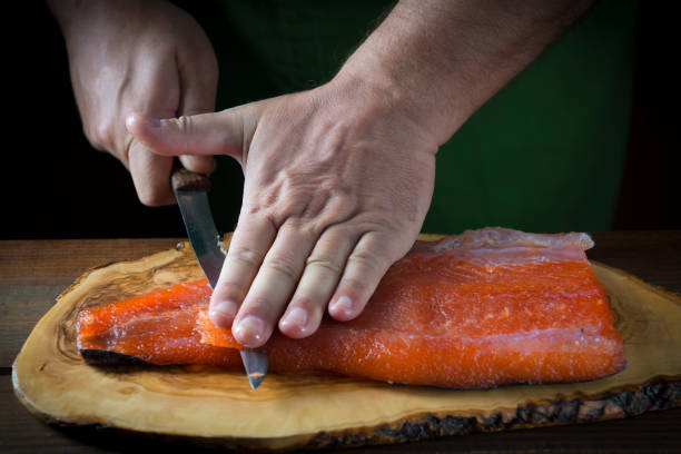 istock Slicing gravlax salmon with a knife 886057374