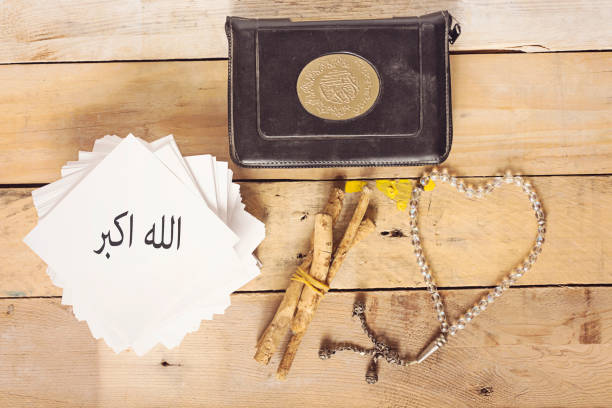 istock allah akbar in arabic and object muslim on wood table 886065486