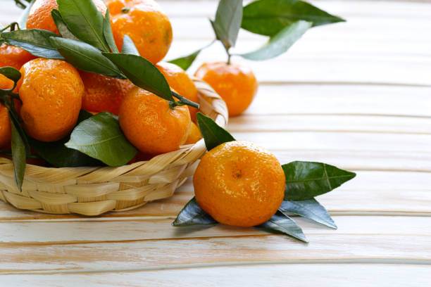 istock fresh organic mandarins with green leaves 886068770