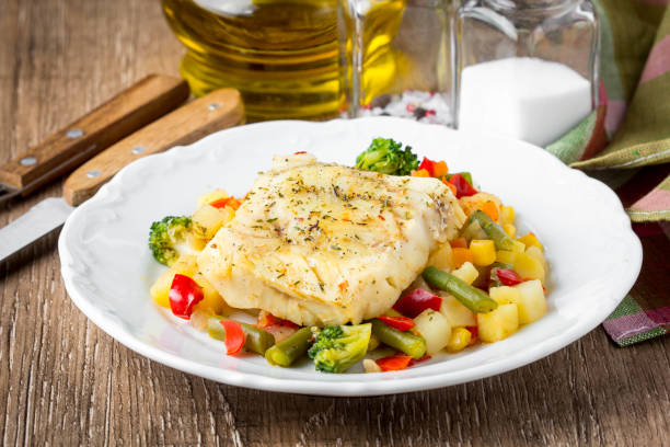 white fish fillet with vegetable stew, cod, sea bass, tilapia, perch, corn, broccoli, potatoes, bell peppers, beans, healthy food, tatsy homemade lunch - bacalhau imagens e fotografias de stock