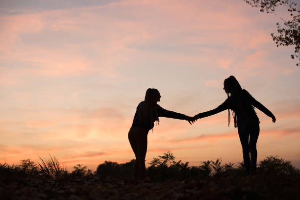 istock Two young women with African braids 886069644