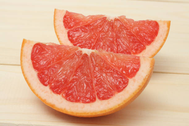 istock healthy food. sliced grapefruit on wooden background 886069680