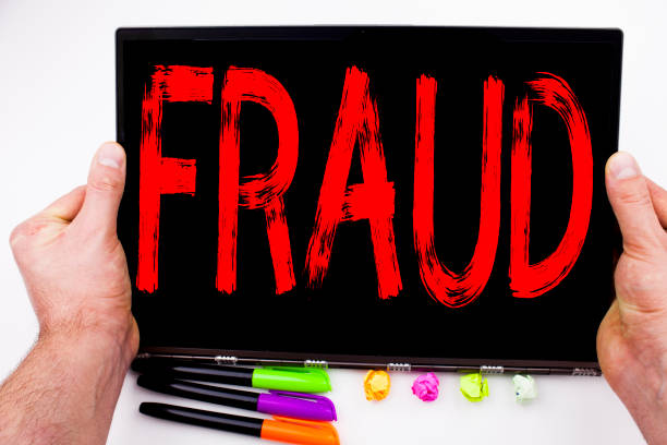 istock Fraud text written on tablet, computer in the office with marker, pen, stationery. Business concept for Criminal hacker security prevention white background with copy space 886079832