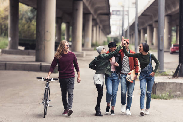 istock stylish people walking outdoors 886089876