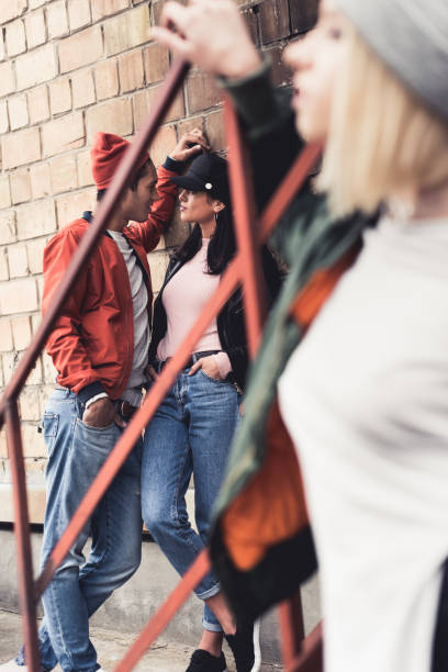 istock stylish young man flirting with woman 886092138
