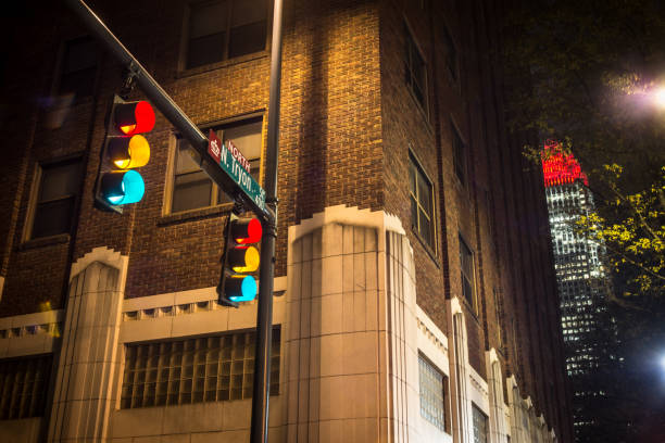 A traffic signal shows all colors at an intersection in uptown Charlotte, NC. 